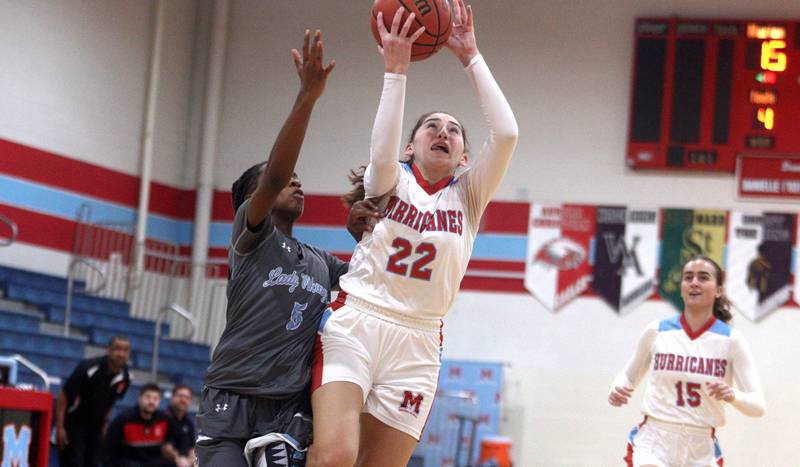 Marian Central’s Ella Notaro moves with the ball against  Rockford Guilford in varsity girls basketball Saturday at Landers Pavilion on the campus of Marian Central High School in Woodstock.