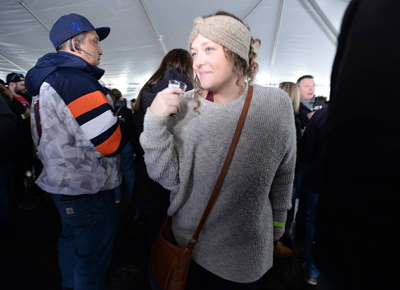 Sarah Egner of Westmont makes her way through the crowd after getting a beer during the Winter Beer Festival held in Westmont Saturday Feb 18, 2023.