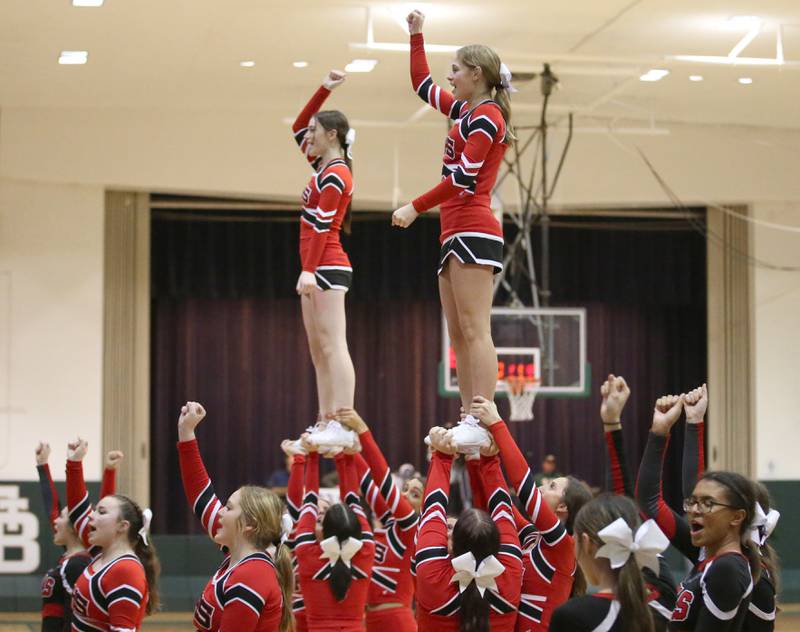 Hall cheerleaders perform during a timeout on Monday, Dec. 14, 2022 at St. Bede Academy.