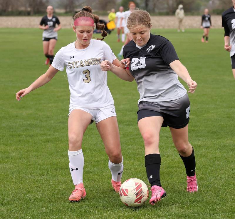 Sycamore's Marin Gautcher (left) and Kaneland's Lindsey Stoddard battle for possession Wednesday, April 30, 2025, during their game at Kaneland High School in Maple Park.