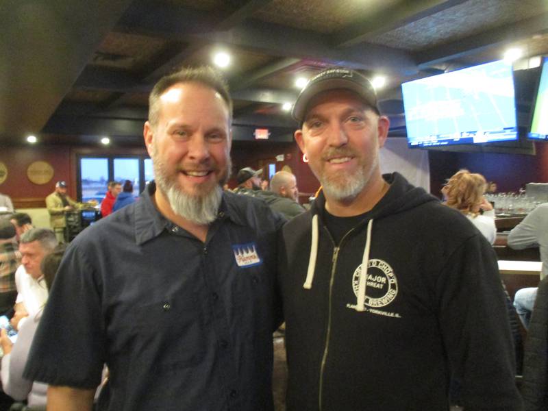 Craft'd co-owner Corey Knowles, left, and general manager Randy Schobert were smiling at the big crowd they attracted to their Yorkville restaurant on its opening day Dec. 27, 2022.