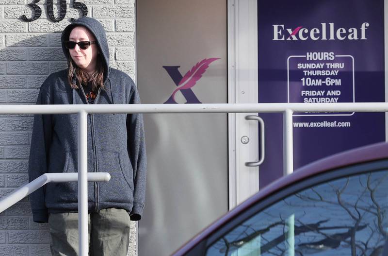 Jessica Beatrice, of DeKalb, waits for the doors to open Friday, Nov. 24, 2023, for the soft opening of Excelleaf in DeKalb. The business is DeKalb County’s first recreational marijuana dispensary.