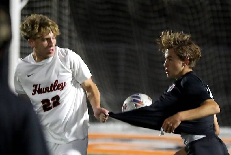 Huntley's Tyler Murray pulls the shirt of McHenry's Kyren Rivard as they battle for the ball during a Fox Valley Conference boys soccer match on Thursday, Oct. 9, 2025, at McCracken Field in McHenry.