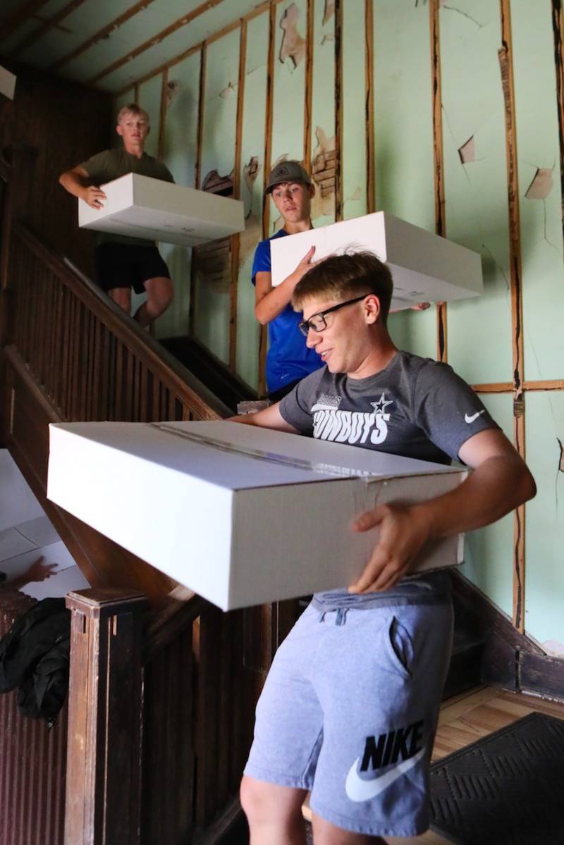 PHS sophomore Konnor Kain helped  move boxes from the third floor of the Sash Stalter Matson Building to the basement in a matter of 15 minutes for the Bureau County Historical Society.