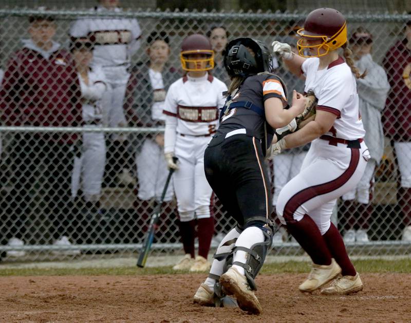 McHenry's Emma Stolzman tags out Richmond-Burton's Emerson Herrick as she tries to score during a non-conference softball game Tuesday March 22, 2022, between Richmond-Burton and McHenry at Richmond-Burton High School.