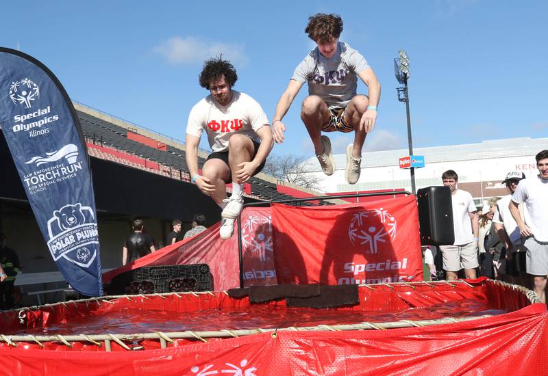 Members of the Delta Zeta sorority leap into the water on a cold and windy Saturday, Feb 17, 2024, during the Huskie Stadium Polar Plunge at Northern Illinois University in DeKalb. The Polar Plunge is the signature fundraiser for Special Olympics Illinois.