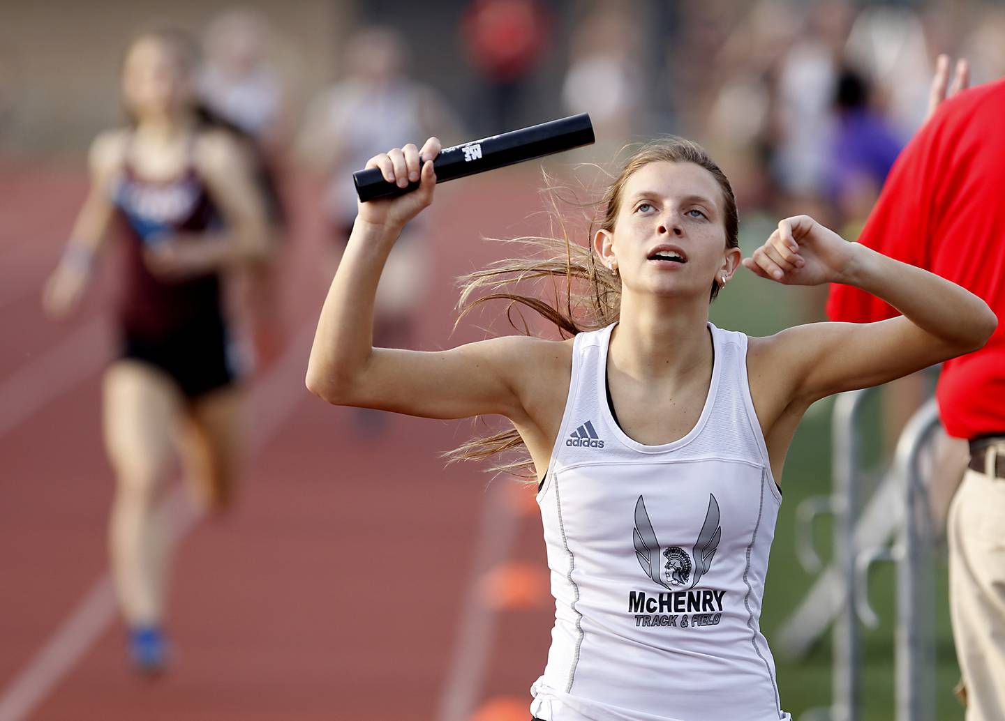 McHenry’s Alyssa Moore celebrates winning the 4x800 relay during the IHSA Class 3A Huntley Girls Track Sectional Wednesday, May 11, 2022, at Huntley High School.