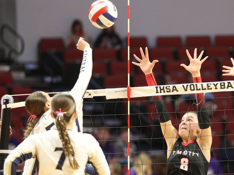 Bloomington Central Catholic's Aubrey Fair sends a spike past Timothy Christian's Elizabeth Alex during the Class 2A State semifinal game on Friday, Nov. 15, 2024 at CEFCU Arena in Normal.