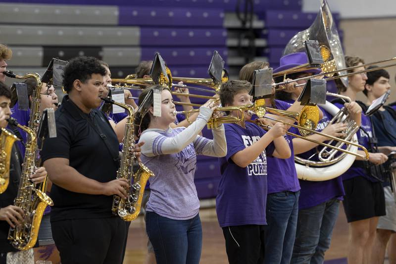 The Dixon High School marching band plays the loyalty song Friday, Sept. 27, 2024, during the school’s homecoming pep rally.