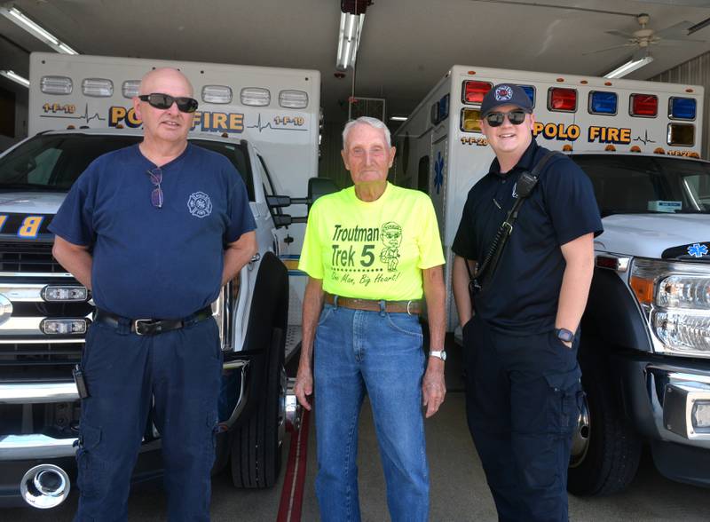Dean Troutman, 92, stands with Polo paramedics Tom Perrin and Nolan Kemp. He stayed overnight at the ambulance station before walking to Forreston on Sunday. He is walking 350 miles through our region to raise money for St. Jude's.