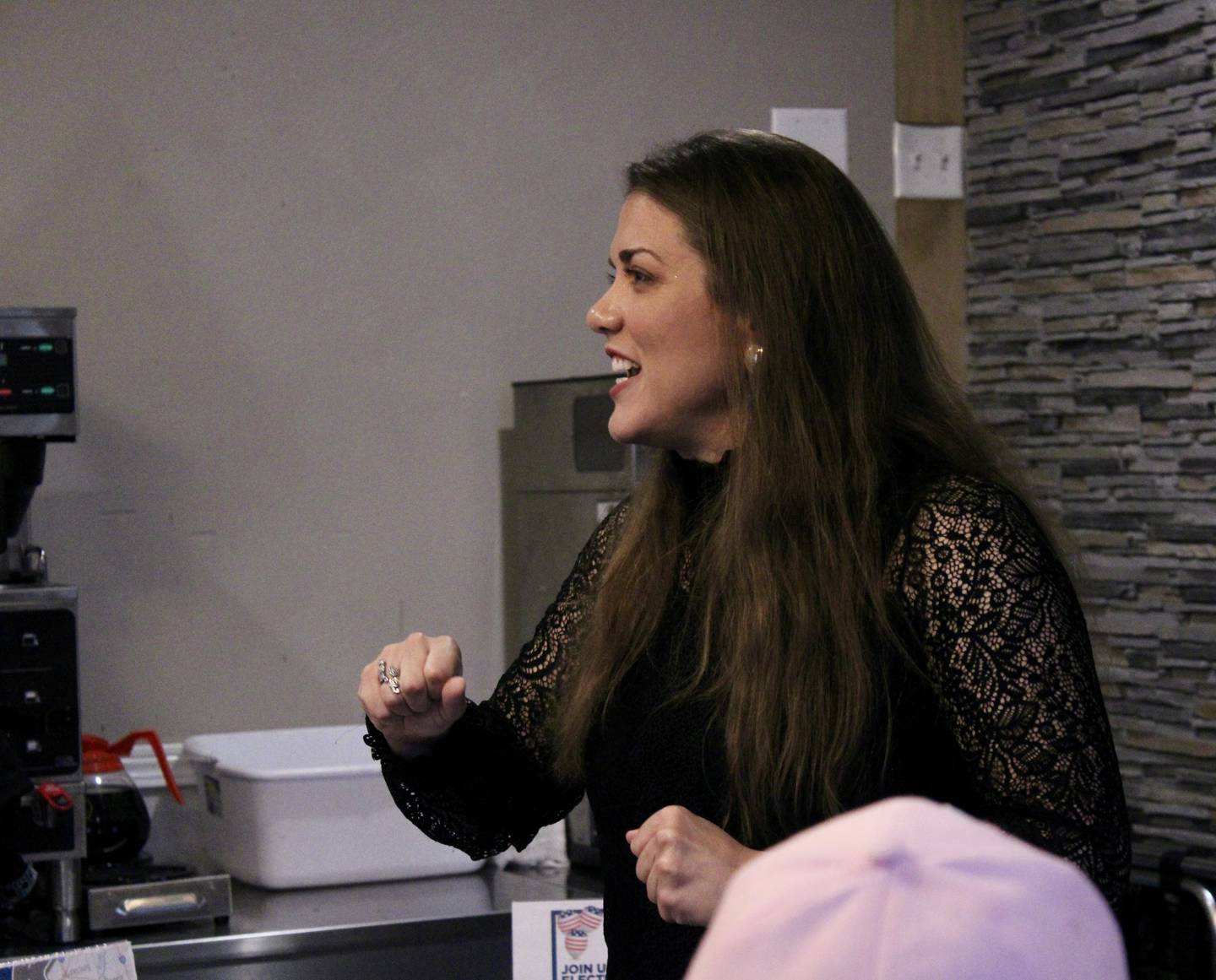 Esther Joy King, Republican candidate for the Illinois 17th U.S. House, gestures as she encourages those in attendance at A's Kitchen on Saturday morning.