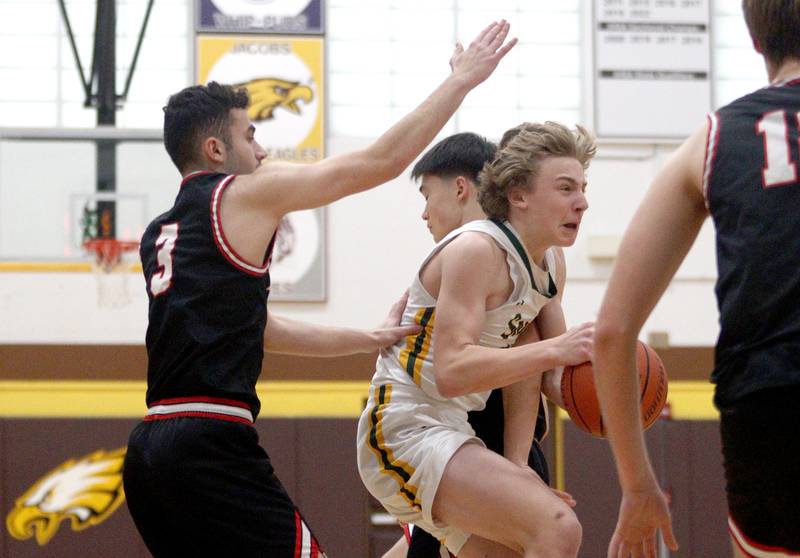 Crystal Lake South’s Carson Trivellini navigates through traffic against Barrington in Hinkle Holiday Classic boys basketball tournament game action at Jacobs High School Tuesday.