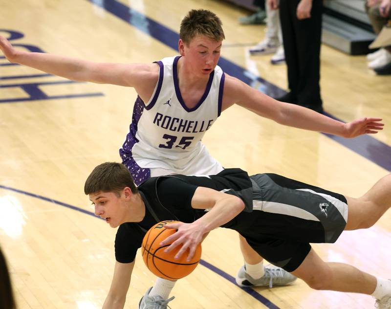 Kaneland's Connor Kimme is tripped up by Rochelle's Eli Schweitzer Tuesday, Feb. 3, 2026, in their game at Rochelle High School.