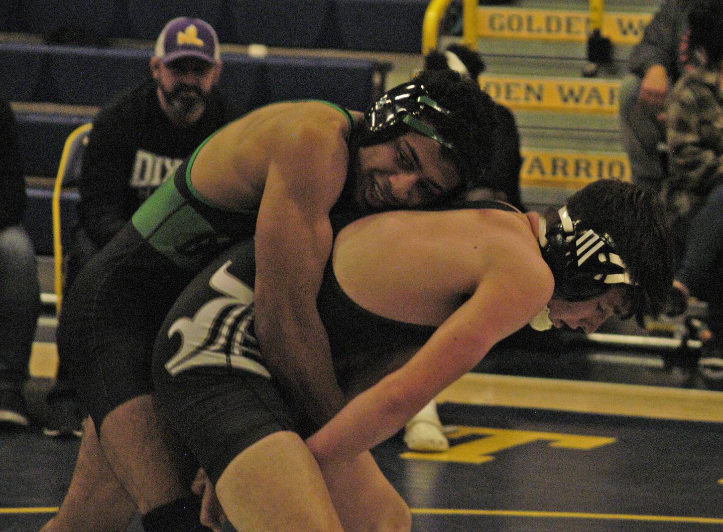 Rock Falls' Adan Oquendo (left) and Dixon's Gavin Kramer (right battle in the 132-pound championship match. The action took place on Saturday, Dec. 2, 2023, at Sterling High School's 45th Annual Carson DeJarnatt Tournament.