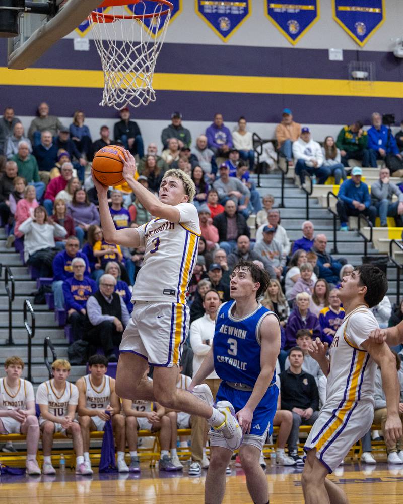 Mendota's Alex Beetz (3) leaps into layup in game against Newman Central Catholic on Friday, January 30, 2026 at Mendota High School in Mendota.