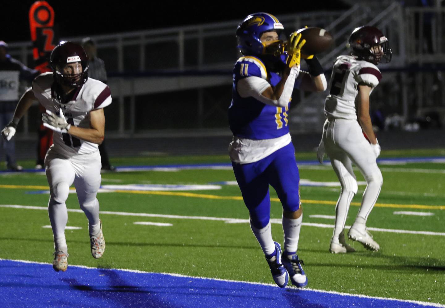 Johnsburg's Ryan Franze catches a touchdown pass in front of Marengo's Alten Bergbreiter during a Kishwaukee River Conference football game on Friday, Oct. 4, 2024, at Johnsburg High School.