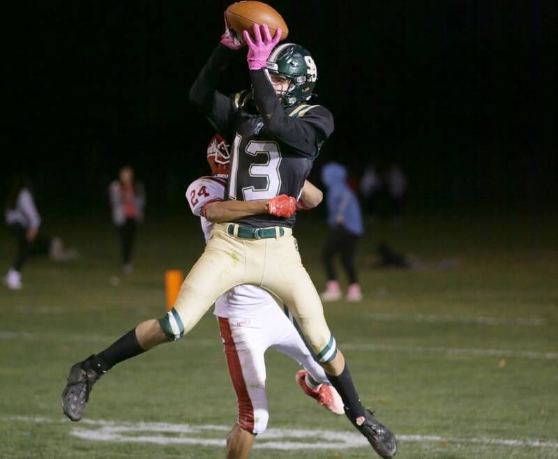St. Bede's Ben Wallace (13) catches the ball in the endzone over Hall's Joel Rangel (24) on Saturday, Oct. 15, 2022 at the Academy in Peru.
