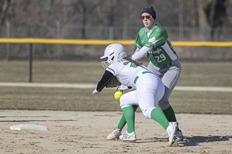 Rock Falls’ Katie Thatcher is safe at second after Geneseo’s Jaelyn Lambin drops the ball during a rundown Wednesday March 29, 2023.