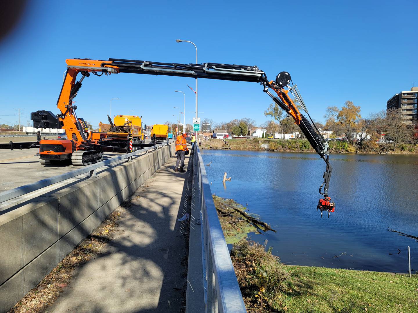 This is an aerial crane with a cutter that Kankakee County purchased to maintain the Kankakee River.