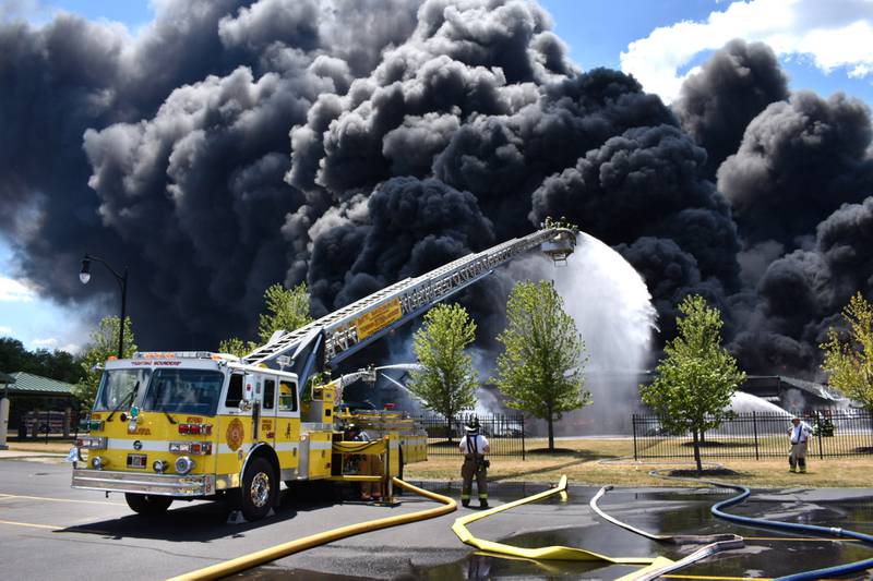 The ladder truck crew from the Mt. Morris Fire Department was one of several fire crews are at the scene of a structure fire at Chemtool on Prairie Hill Road in Rockton Monday morning. Smoke from the fire could be seen from Ogle County prompting the sheriff to issue a warning to residents living east of Meridian Road.