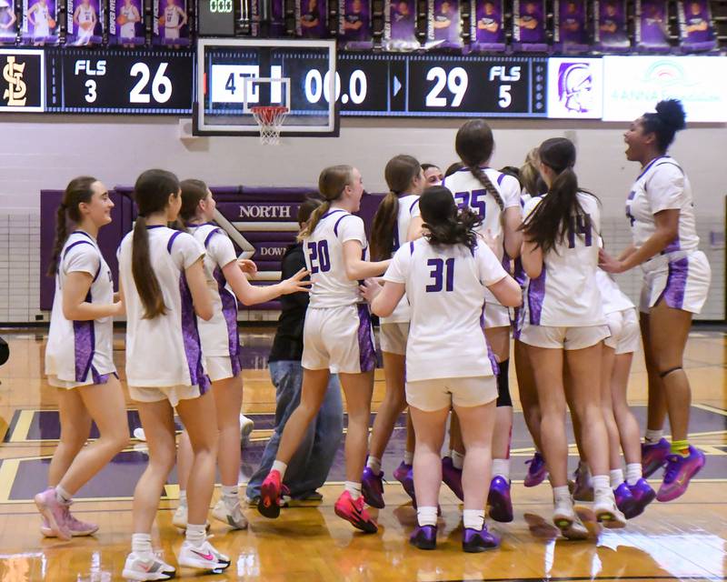 Downers Grove North celebrates their 4A regional championship victory over St. Laurence on Thursday Feb. 19, 2026, held at Downers Grove North High School.