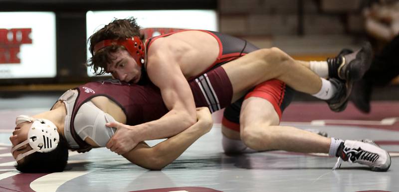 Huntley’s Collin Huminsky pins Prairie Ridge’s Leo Ruiz during the 138-pound match of a Fox Valley Conference boys wrestling meet on Thursday, Jan. 22, 2026, at Prairie Ridge High School Crystal Lake.