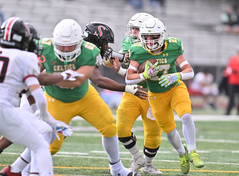 Providence Catholic's Jackson Killeen (27) rushes the ball during the class 5A first round playoff game against Springfield on Saturday, NOV. 01, 2025, at New Lenox.