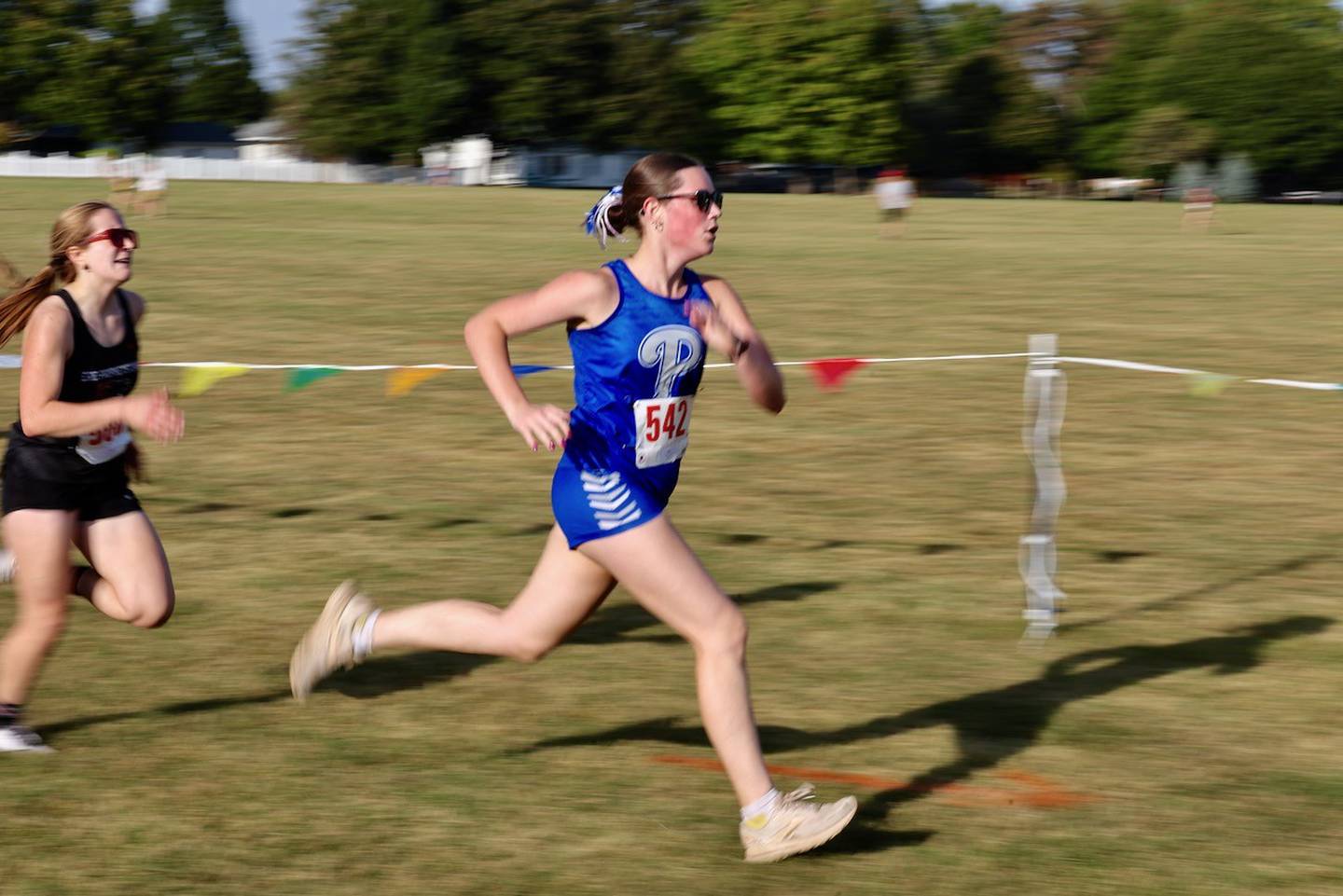 Princeton's Natalie Meyer runs to the finish in Tuesday's Three Rivers Conference Meet at Zearing Park in Princeton. The Tigresses finished second, just three points behind Sherrard.