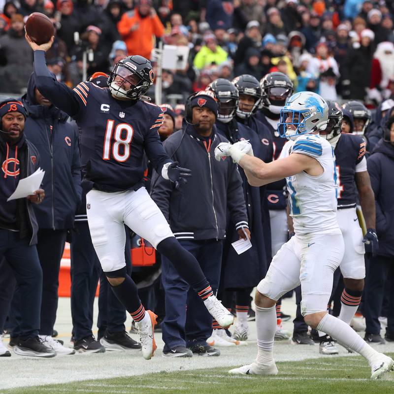 Chicago Bears quarterback Caleb Williams throws the ball as he is pushed out of bounds by Detroit Lions linebacker Ben Niemann during their game Sunday, Dec. 22, 2024, at Soldier Field in Chicago.