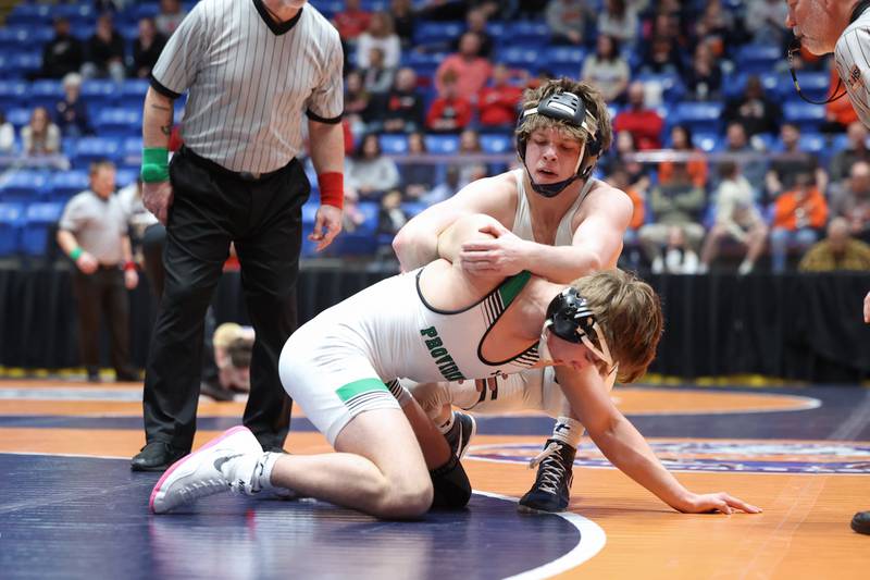 IC Catholic's Aiden Arnett works to flip Providence Catholic's Andrew Pellicci in the 150-pound match during IC Catholic's victory in the IHSA Class 2A Dual Team State championship on Saturday, Feb. 28, 2026.