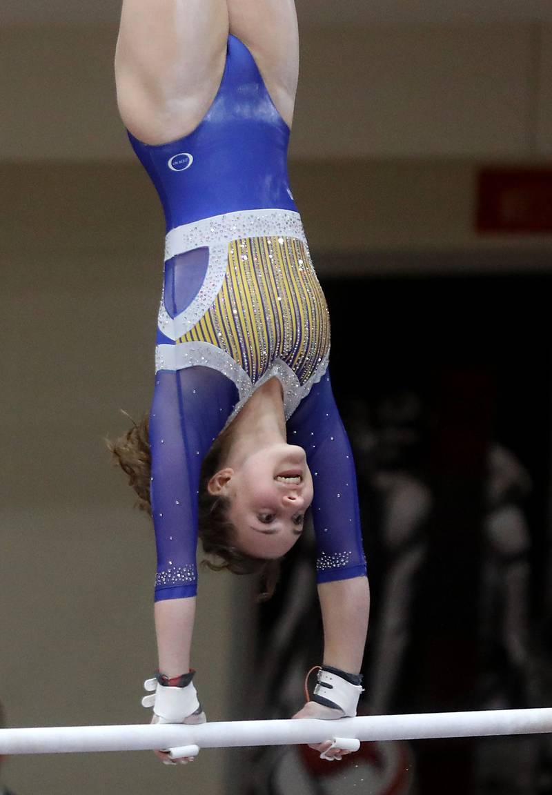 Geneva’s Nora Werner competes in the preliminary round of the parallel bars on Friday, Feb. 20, 2026, during the IHSA Girls State Final Gymnastics Meet at Palatine High School.