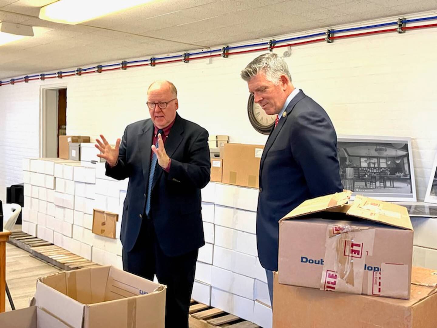Bureau County History Center Executive Director Lex Poppens (left) gives U.S. Rep. Darin LaHood a tour of the research room Aug. 7, 2024, at the Sash Stalter Matson Building on the history center campus in Princeton.