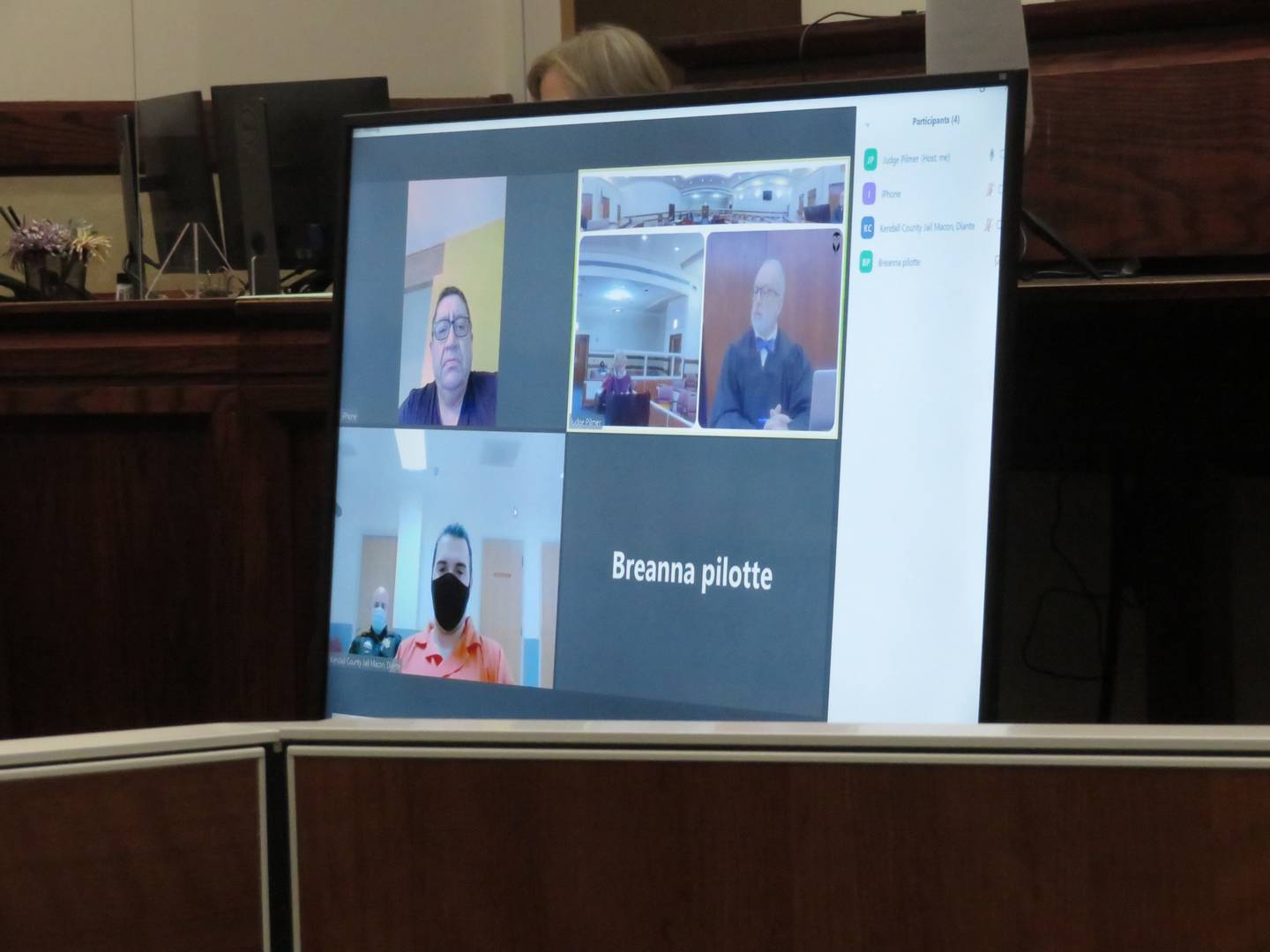 James A. Davidson (bottom left) listens via Zoom as Kendall County Public Defender Victoria Chuffo (top right) talks during a Monday court hearing Monday at the Kendall County Courthouse in Yorkville.