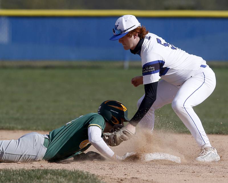 Burlington Central's Michael Person tries to tag out Crystal Lake South's Liam Sullivan at second base during a Fox Valley Conference baseball game on Friday, April 12, 2024, at Burlington Central High School.