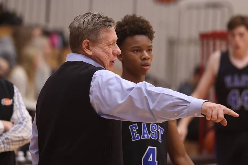 Lincoln-Way East head coach Rich Kolimas talks with BJ Powell against Lincoln-Way West.