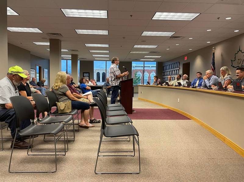 Shannon Lovett, owner of Lovett's Towing & Recovery who wants to put a secondary location at 531 E. Sycamore St. in Sycamore, speaks during the public comment portion of the Sycamore City Council meeting at the City Center on July 5, 2022.