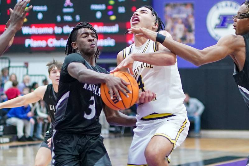 Kaneland's Marshawn Cocroft (3) strips the ball from Yorkville Christian's Tray Alford (4) during a championship final basketball game in the 61st annual Plano Christmas Classic at Plano High School on Saturday, December 28, 2024.