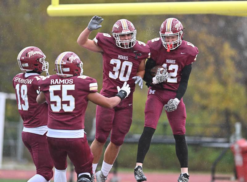 Morris Rj Kennedy (12) celebrates with teammates during the class 4A second round playoff game against Metamora on Saturday, NOV. 08, 2025, at Morris.