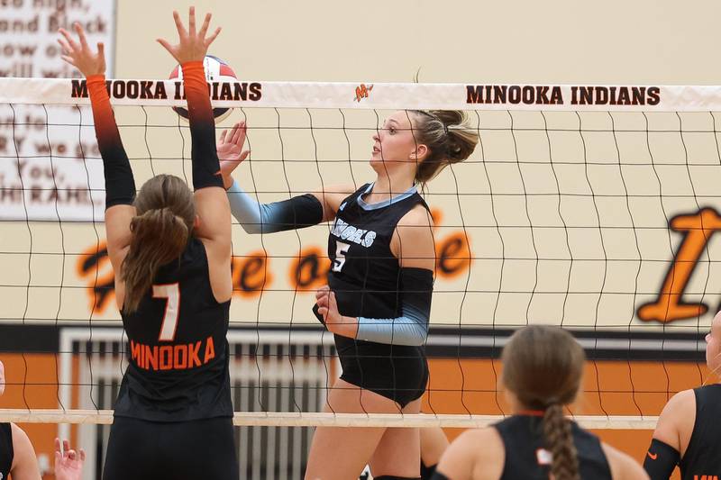 Joliet Catholic’s Delani Kirstein pushes over a shot against Minooka on Wednesday, Sept. 4, 2024 in Minooka.
