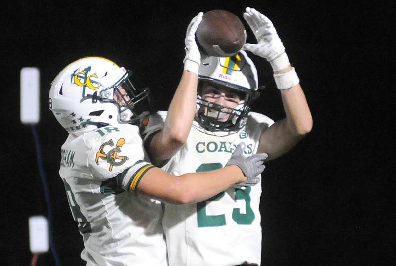 Coal City's Aiden Scrogham (18) celebrates teammate Gavin Berger's touchdown against Streator on Friday, Sept. 19, 2025 at Doug Dieken Stadium.