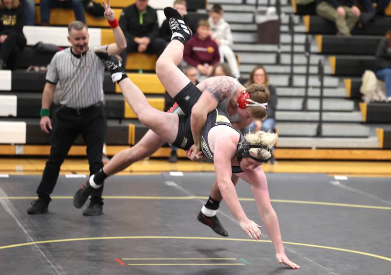 LaSalle Peru’s Connor Lorden takes down Sycamore’s Tristan Countryman in the 220 pound match Thursday, Dec. 1, 2022, during the meet at Sycamore High School.