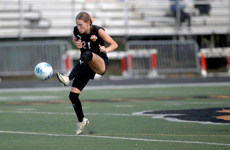 Wheaton Warrenville South's Ashlyn Adams kicks the ball during a game against St. Charles East on Friday, May 16, 2025 in Wheaton.