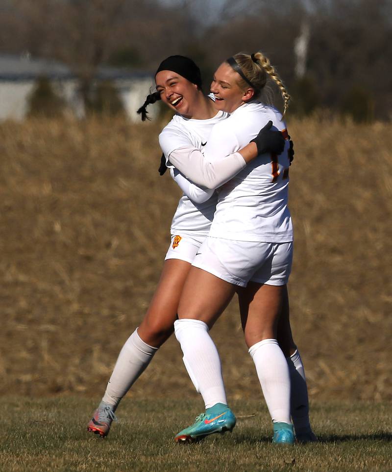 Richmond-Burton’s Brianna Maldonado (left) and Jordon Otto celebrate a goal during a Kishwaukee River Conference soccer game against Johnsburg on Wednesday, March 20, 2024, at Johnsburg High School.