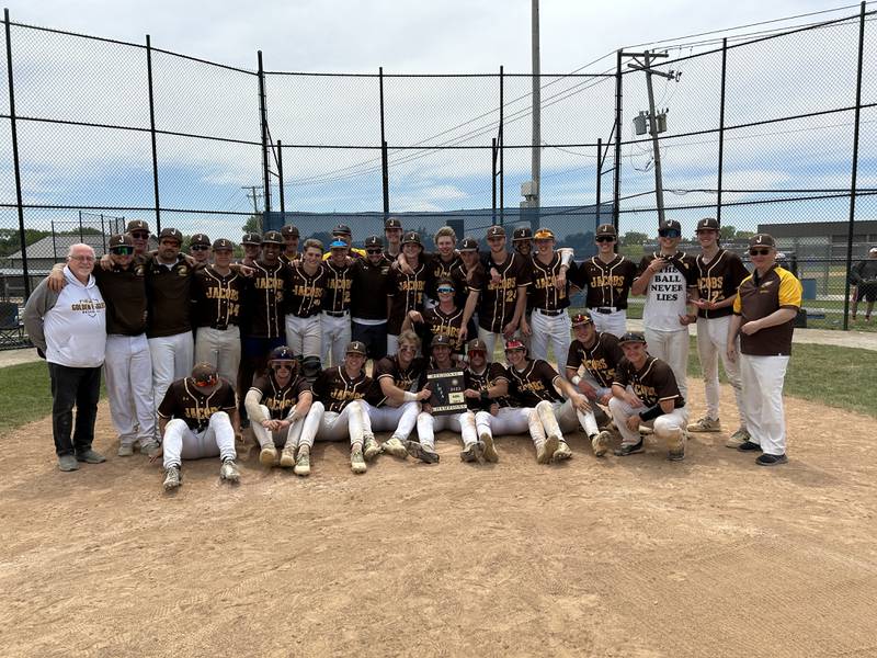 Jacobs players and coaches pose with their plaque after coming back to beat McHenry 9-5 to take the Class 4A Dundee-Crown Regional title in Carpentersville on Saturday.
