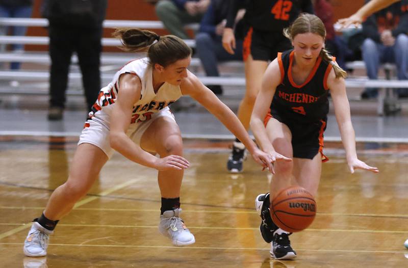 Crystal Lake Central's Kathryn Hamill tries to steal the ball from McHenry's Peyton Stinger during a Fox Valley Conference girls basketball game Tuesday, Nov.. 29, 2022, between Crystal Lake Central and McHenry at Crystal Lake Central High School.