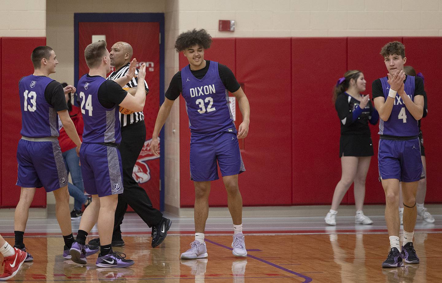 Teammates celebrates Dixon’s Darius Harrington’s record breaking basket Tuesday, Feb. 4, 2025, in Oregon.