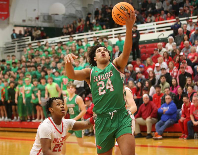 L-P's Marion Persich drives to the hoop past Streator's Tristain Finley during the Class 3A Regional title game on Friday, Feb. 28, 2025 in Sellett Gymnasium at L-P High School.