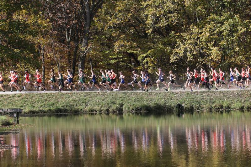 Cross Country boys begin the Class 1A Regional Cross Country race on Saturday, Oct. 22, 2022 at the Seneca FFA Farm in Marseilles.