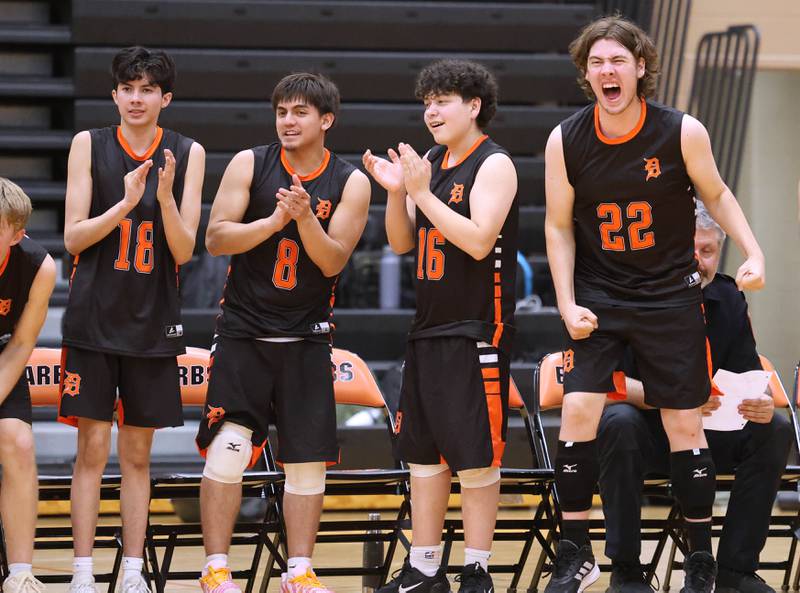 The DeKalb bench celebrates a point Tuesday, April 21, 2026, during their match against Naperville North JV at DeKalb High School.
