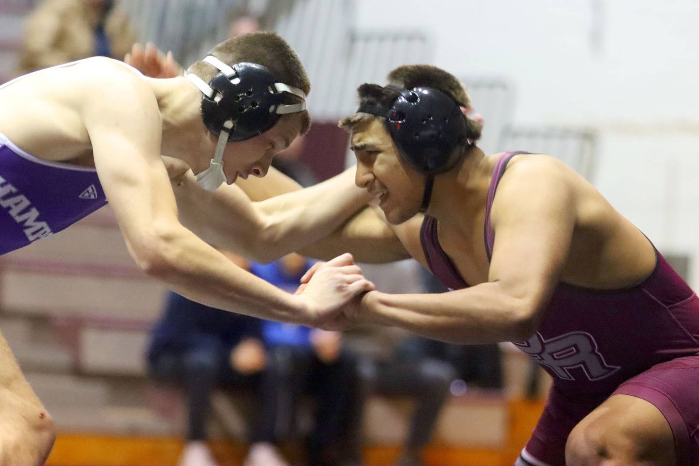 Prairie Ridge’s  Aiden Rodriguez, right, battles Hampshire’s John Janicki at 175 pounds in varsity boys wrestling on Thursday, Dec. 4, 2025, at  Prairie Ridge High School in Crystal Lake.